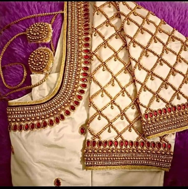 Intricate peacock aari work on silk blouse